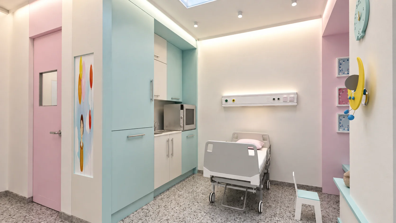 Pediatric patient room at Allameh Bohlul Gonabadi Hospital with light blue cabinetry and a hospital bed