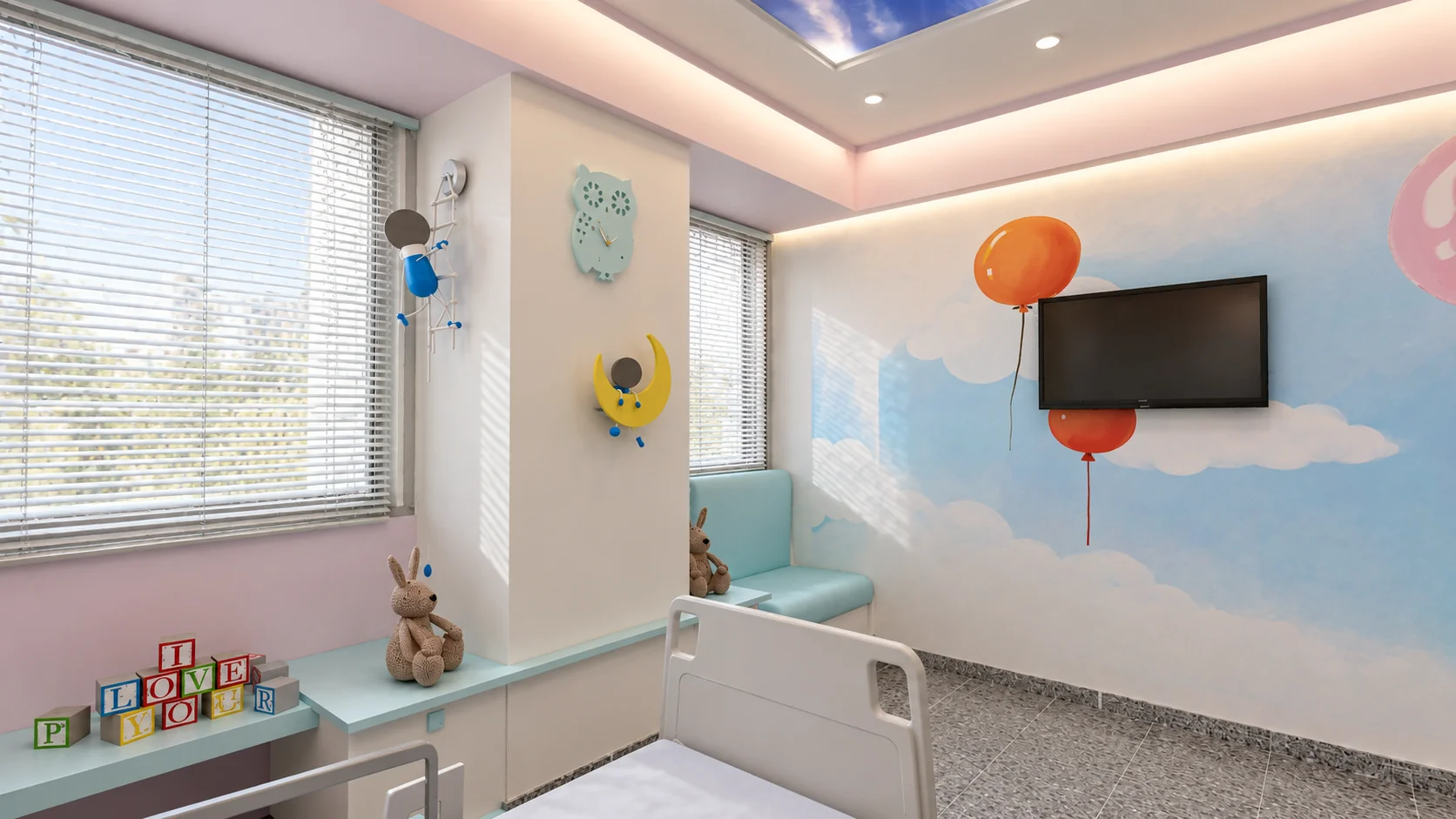 Pediatric patient room with balloon wall graphics, television and companion seating at Allameh Bohlul Gonabadi Hospital