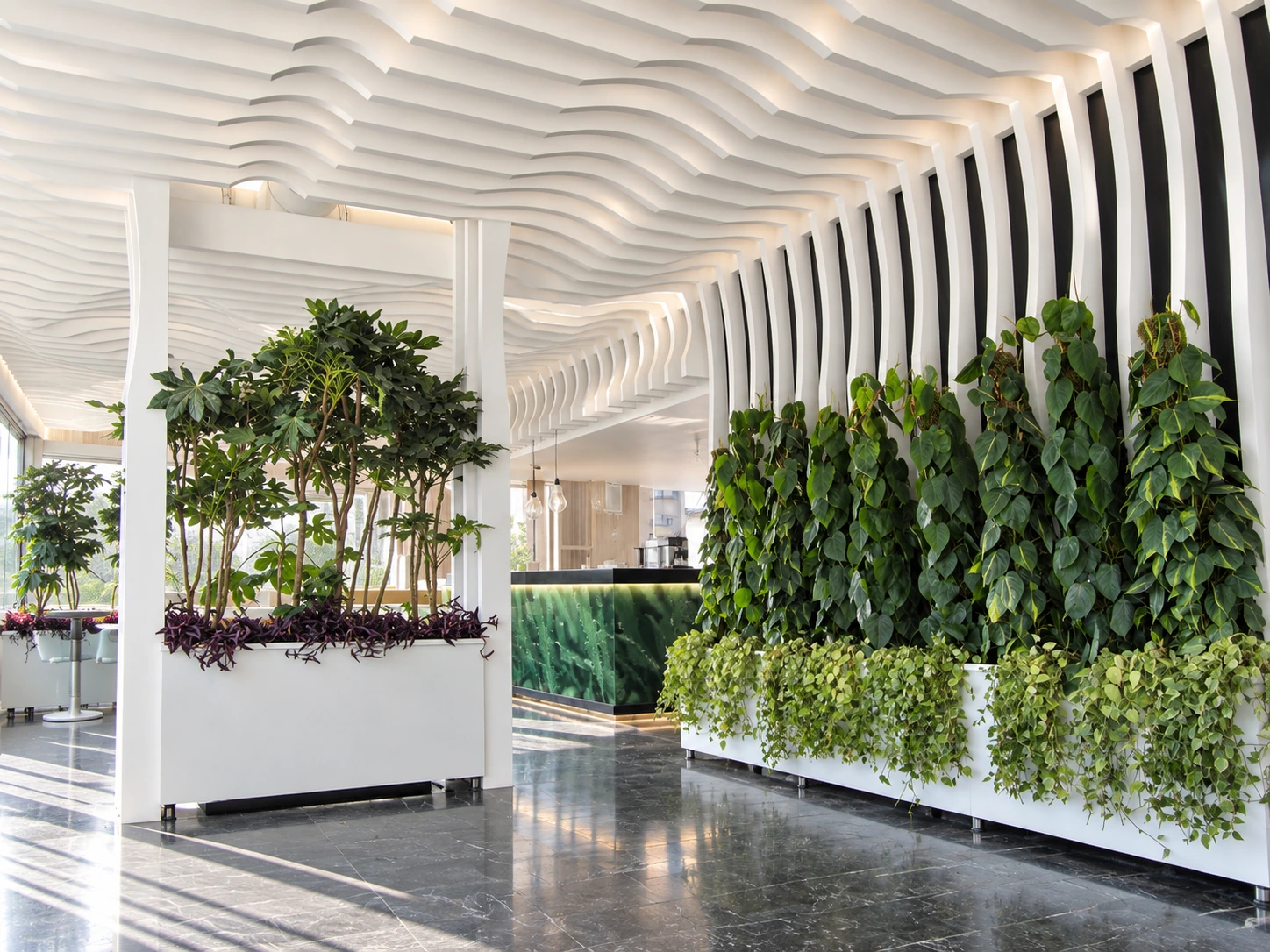 Overview of the seating area at Atiyeh Hospital Café with sculptural ceiling and indoor planting