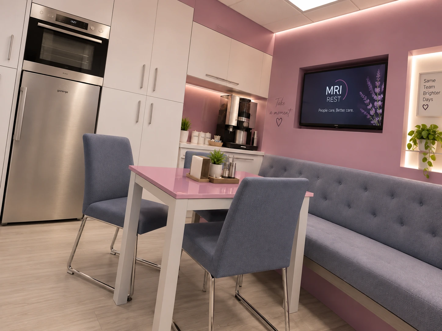 MRI rest area at Dey Hospital in Tehran with pink dining table, blue bench seating and an integrated kitchenette