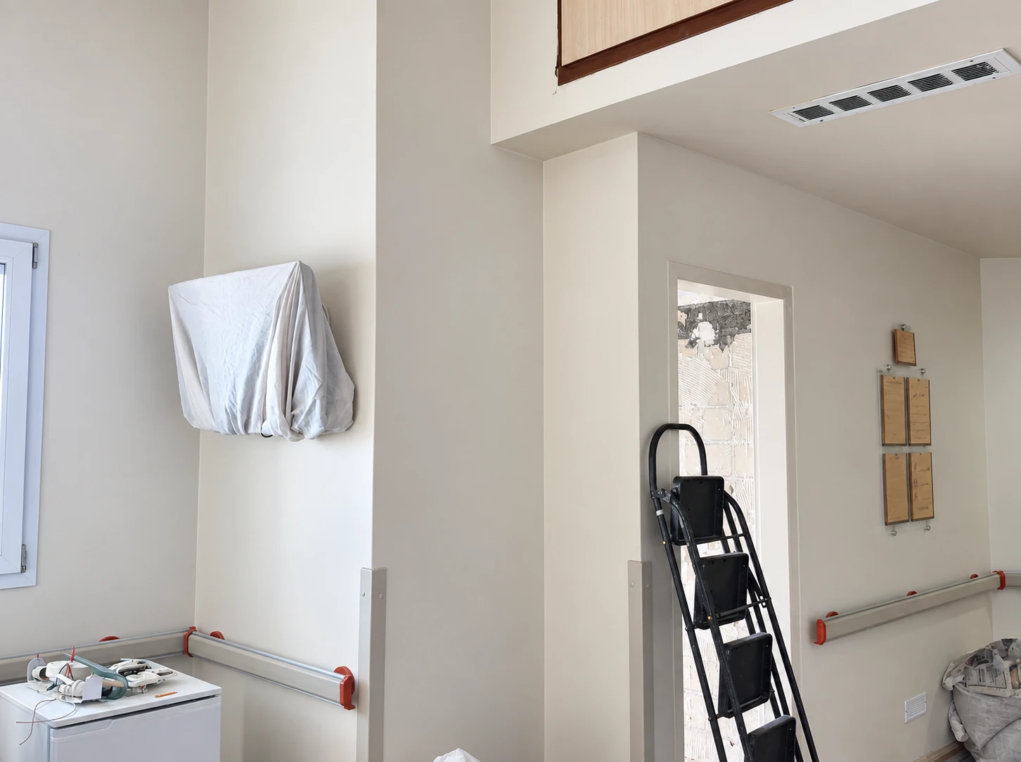 Interior construction stage of the Dey Hospital VIP ward during installation and finishing works