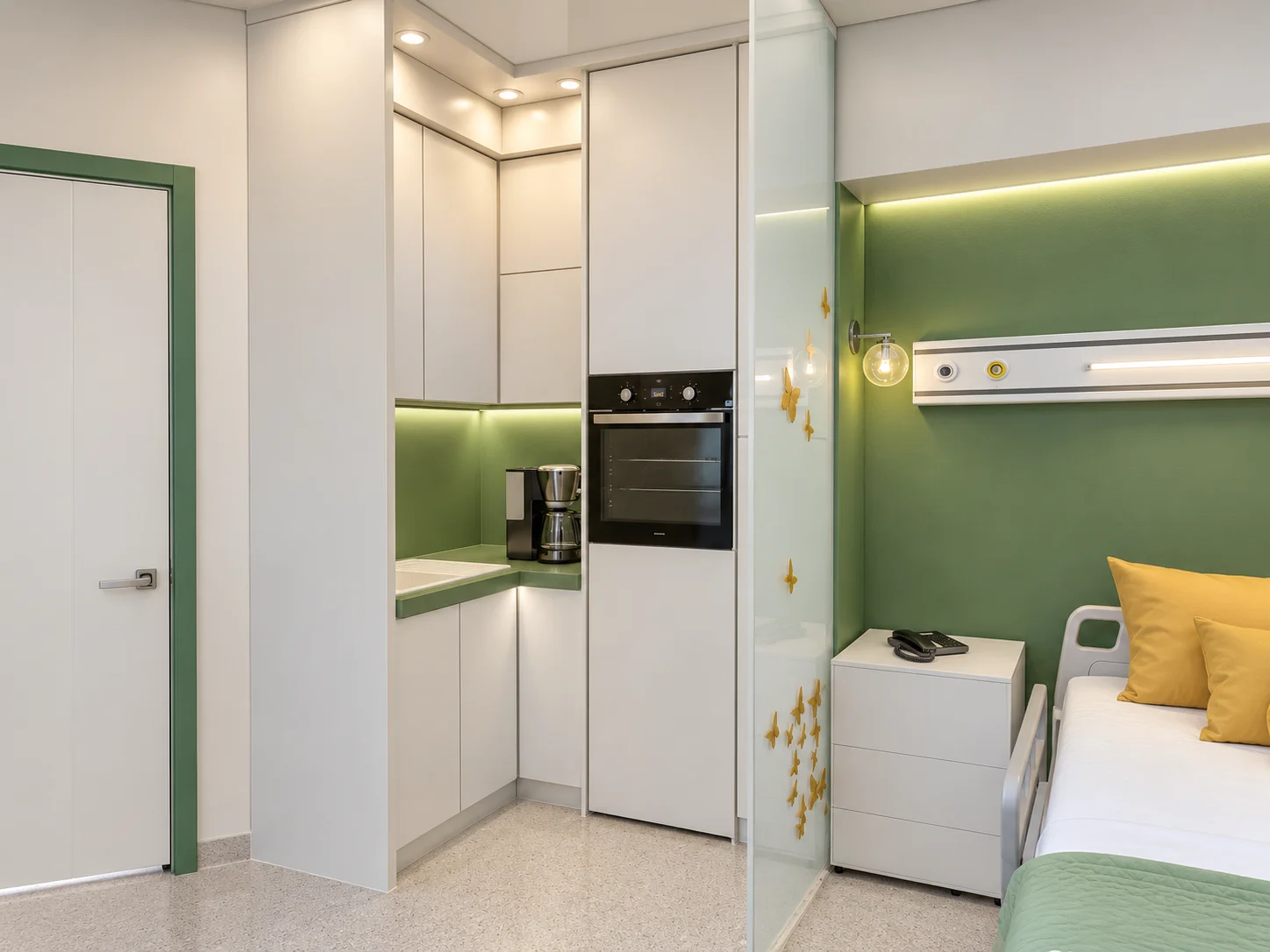 Integrated cabinetry and support elements within the Baqiyatallah Hospital CCU interior