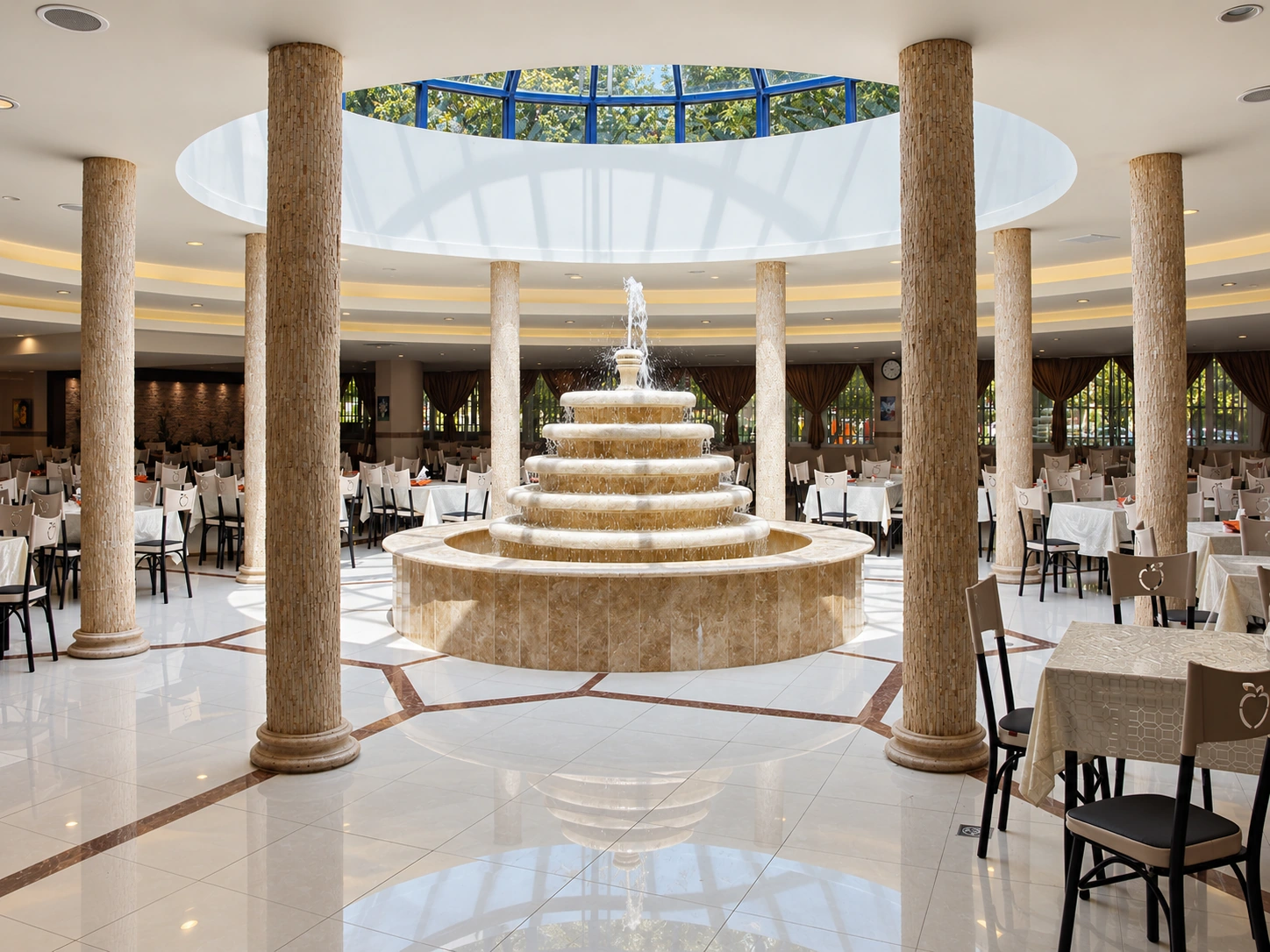 Shahid Rajaee Heart Center staff restaurant in Tehran with central tiered fountain, circular skylight and dining tables
