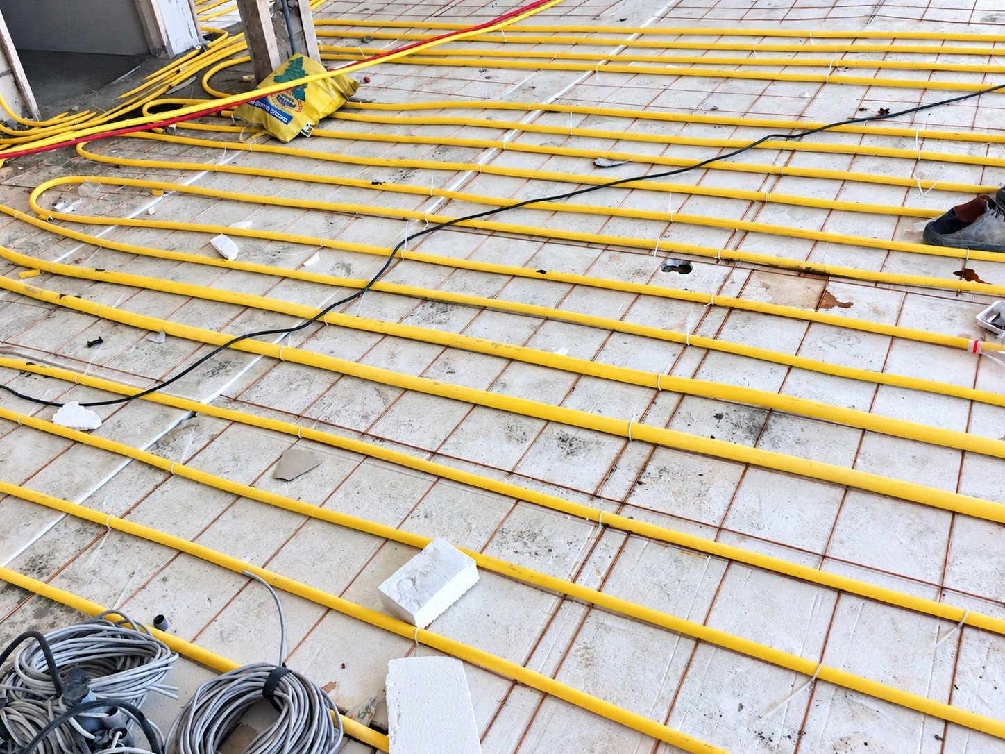Underfloor infrastructure installation phase during construction of Yekta Laboratory