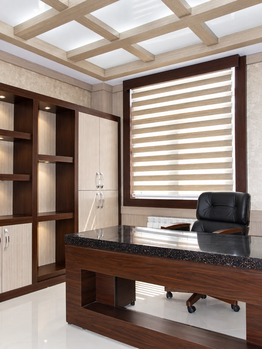 Executive office at Jam Building with custom walnut desk, shelving and window-side workspace