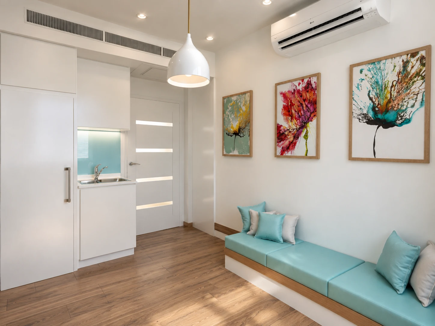 Interior view of the breastfeeding room with sink, storage and linear seating at Tehran Pars Hospital
