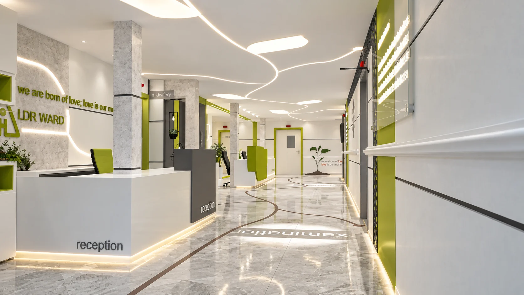 Reception corridor in the Tehran Pars Hospital maternity and LDR ward with green wayfinding accents